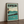 Kapalua golf print framed on a wooden floor