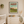 Nursery room with a crib, dresser, and framed Kiawah South Carolina poster on the wall.