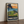 Pebble Beach golf print framed on a wooden floor