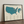 Top 100 US golf courses print framed on a wooden floor