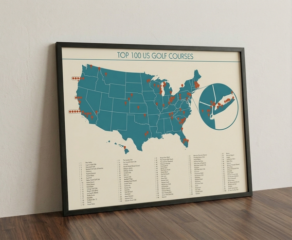 Top 100 US golf courses print framed on a wooden floor